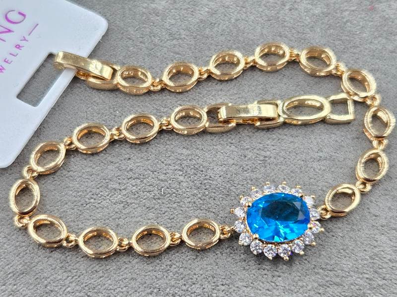 Браслет Xuping  з блакитним стразом 13 мм довжина 17 см колір золото 18к