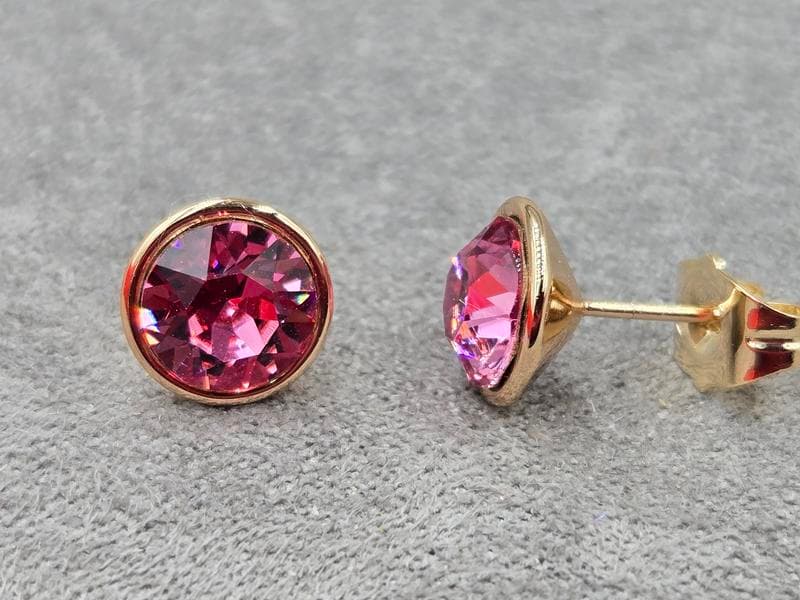 Гвоздики Xuping 9 мм з рожевим стразом Swarovski колір 18к