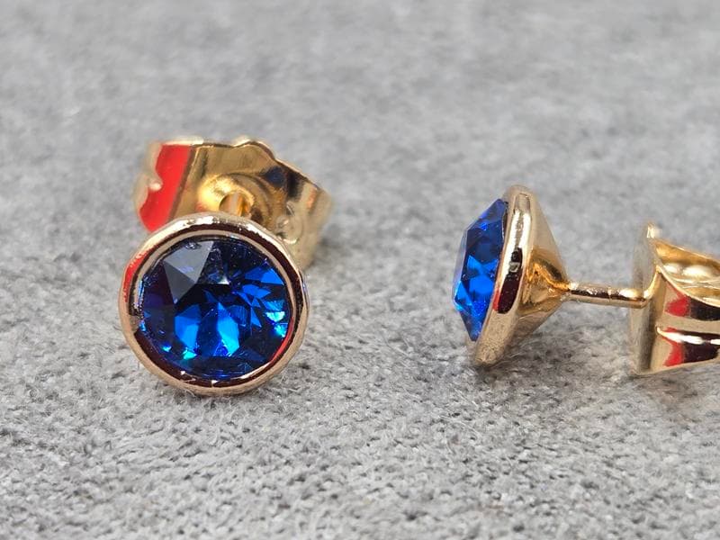 Гвоздики Xuping 7 мм з синім стразом Swarovski